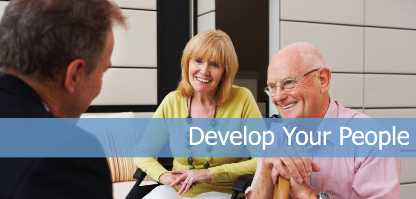 elderly couple in discussion with man in a suit photograph