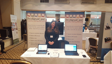 Kelly From Profiles4Care in front of exhibition stand