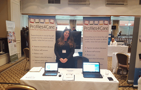 Kelly From Profiles4Care in front of exhibition stand