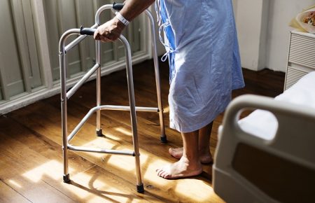 patient using walking frame